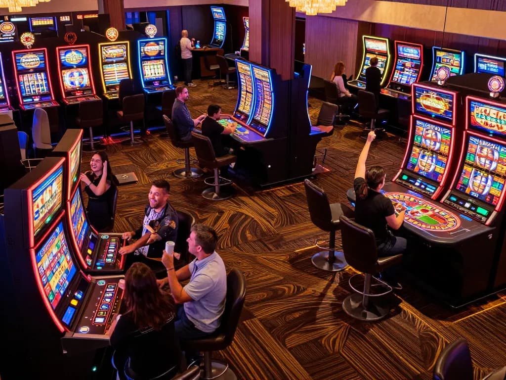Players enjoying their gaming experience at non Gamstop casinos, vibrant slot machines and roulette table in action.